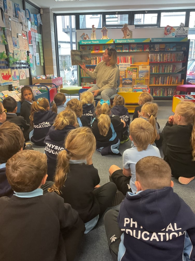 Dartmouth pupils listening to the story by author Erin Allgrove.